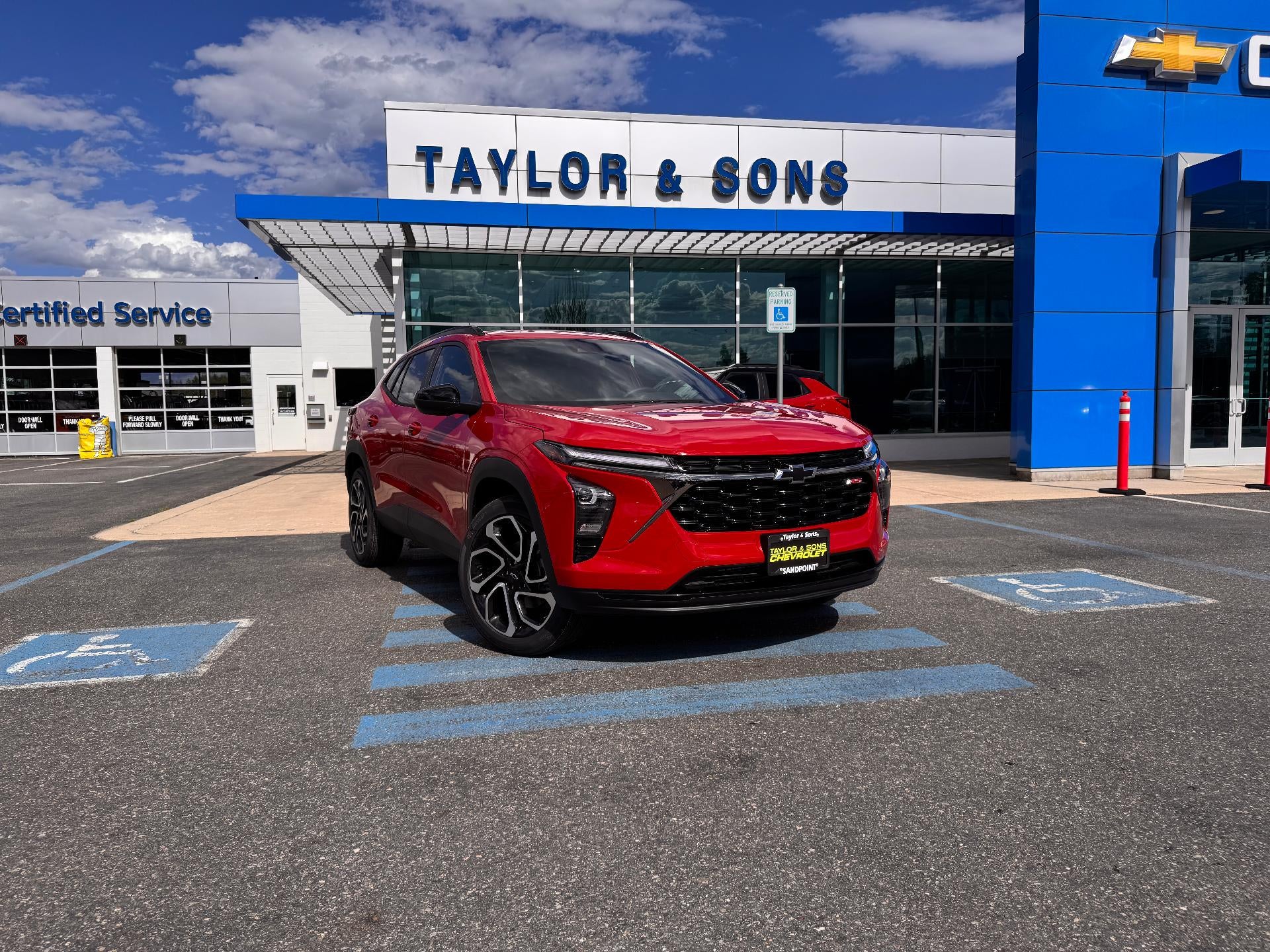 2026 Chevrolet Trax 2RS / 1.2 TURBO / HEATED SEATS / SAFETY PCKG / ADAPTIVE CRUISE in Apex Red — front three-quarter view